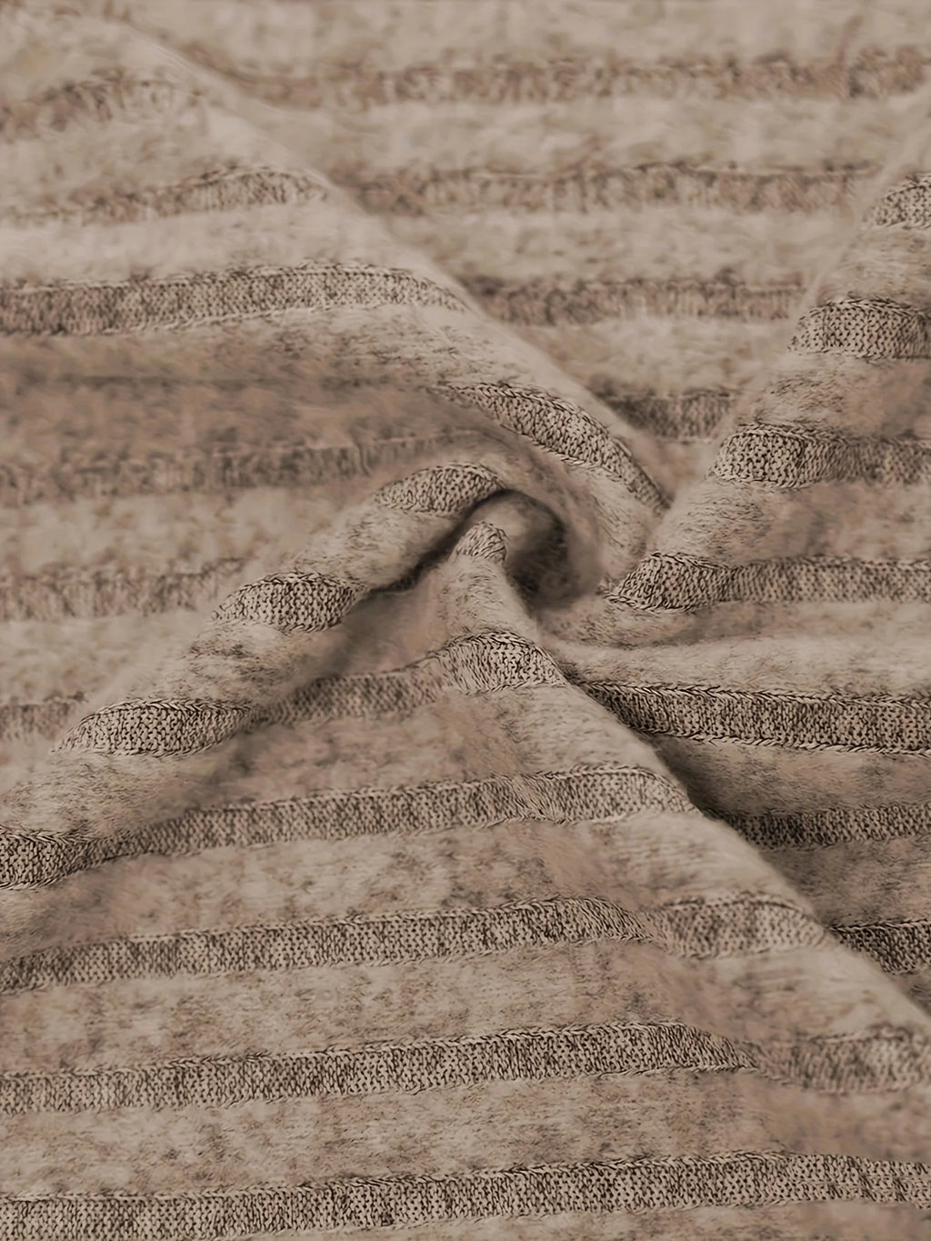 Close-up of beige fabric with subtle pattern