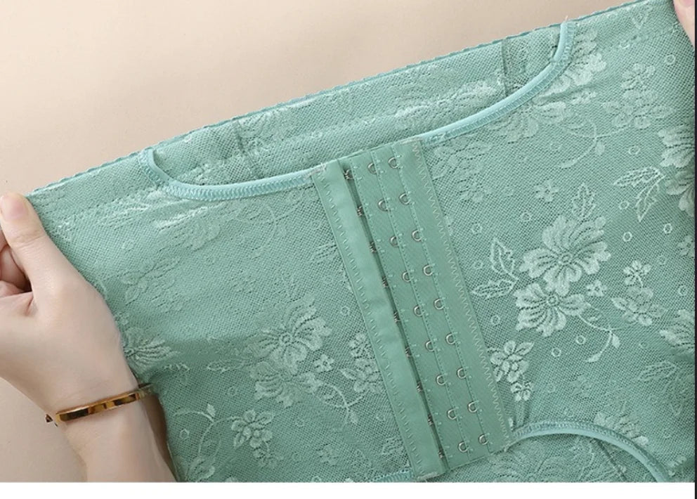 Green floral-patterned underwear held by a hand