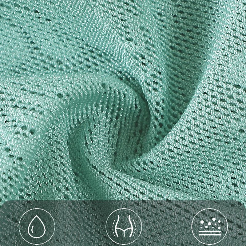 Close-up of green textured fabric with water, stretch, and stain resistance icons at the bottom.